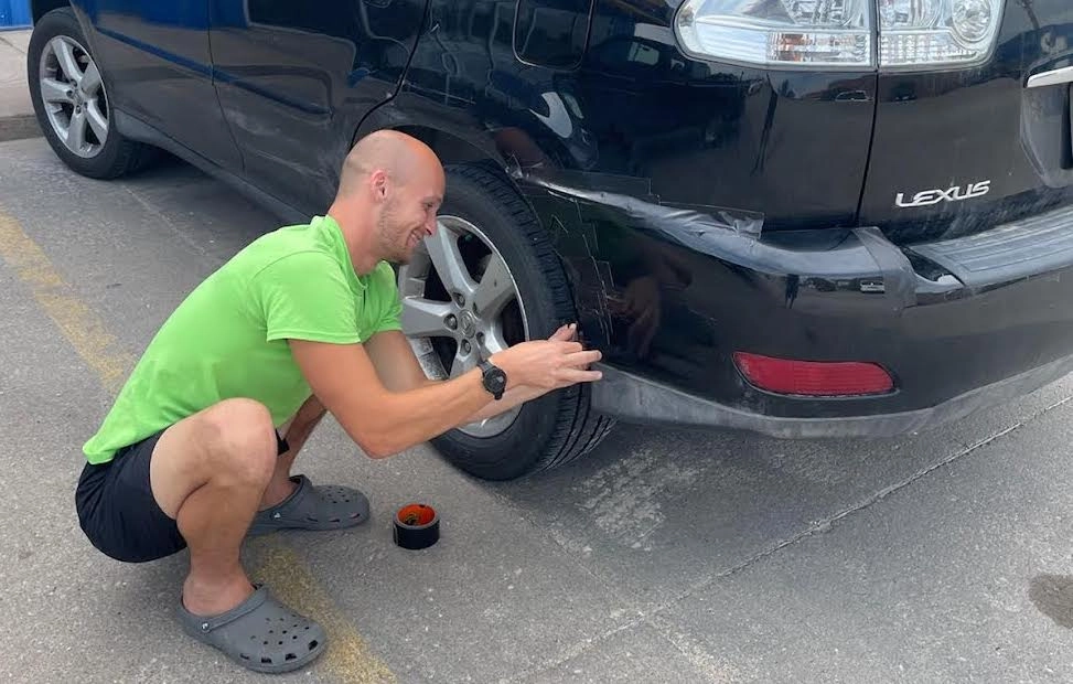 Ryan duct-taping the Lexus.